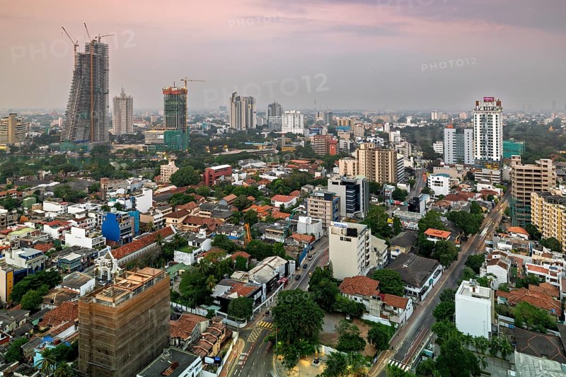 Urban scene at dusk with high-rise buildings and quiet surroundings, The skyline of Colombo in Sri Lanka