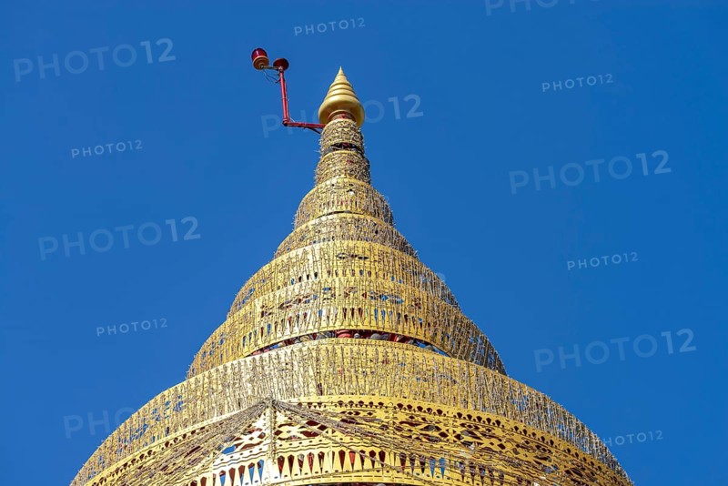 Umbrella over the Buddha statue in Wat Intharawihan, a ceremonial, often multi-level symbol of protection and sanctuary, Wat Intharawihan, the temple was built at the beginning of the Ayutthaya period, Bangkok, Thailand
