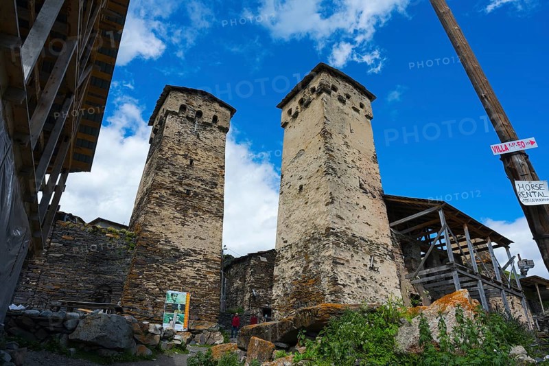 Two old stone towers under a cloudy sky, defensive towers, Ushguli, Ushguli, Shibiani district, Zhibiani, Upper Svaneti, Svaneti, Georgia