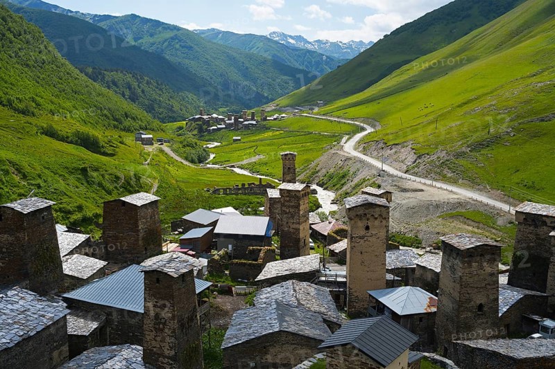Village with several towers and a road in lush mountain scenery, defensive towers, Ushguli, Ushguli, Chazhashi district, Mingrelia region and Upper Svaneti, Svaneti, Georgia