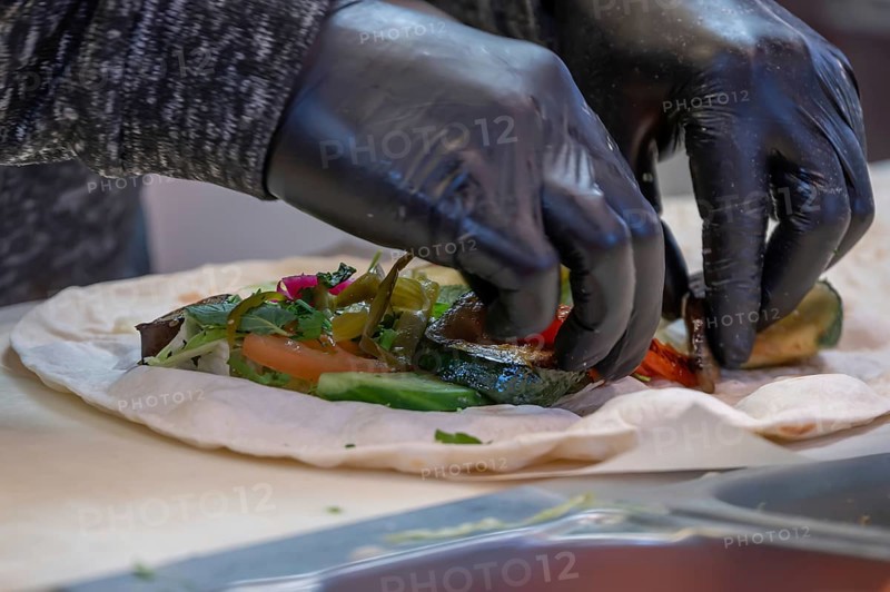 Preparation of falafel with vegetables at a falafel stand in the pedestrian zone, Nuremberg, Middle Franconia, Bavaria, Germany