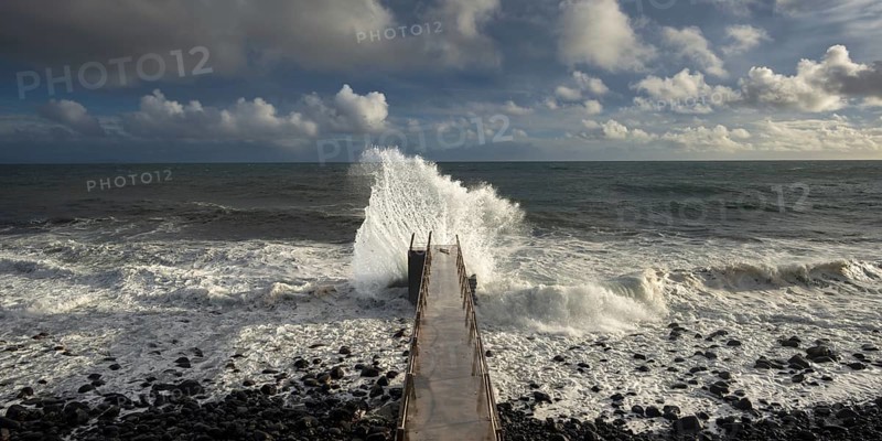 Pier during storm, bridge with waves, Atlantic Ocean, Madeira, Portugal