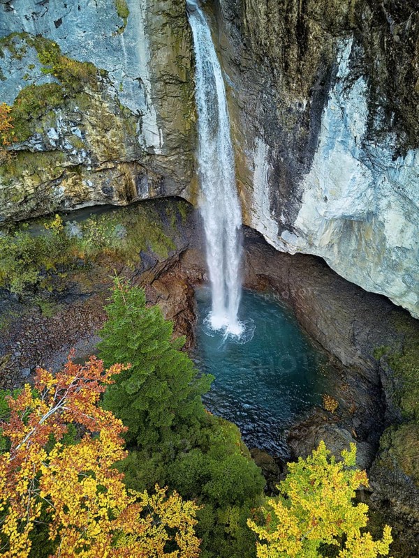 Aerial view of Berglistüber waterfall in autumn-colored surroundings, Linthal, Klausenpass, Canton of Glarus, Switzerland