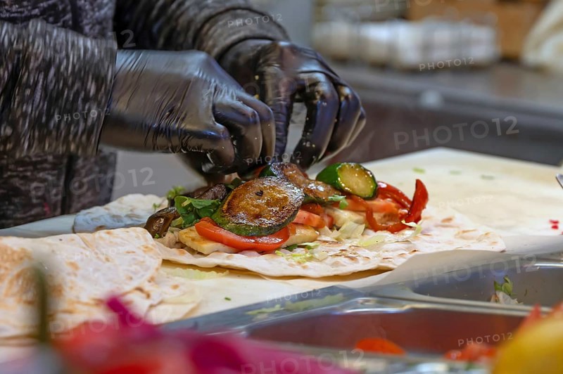 Preparation of falafel with fresh vegetables in a falafel stand in the pedestrian zone, Nuremberg, Middle Franconia, Bavaria, Germany
