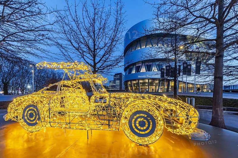 The Mercedes-Benz Museum in Stuttgart presents a journey through the automotive history of the global corporation. 160 vehicles are shown. At Christmas time, there is a light installation in front of the building. It represents the iconic classic Mercedes SL car. Night shot. Stuttgart, Baden-Württemberg, Germany