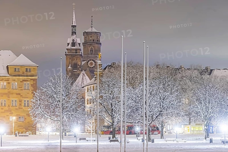 Winter in Stuttgart. The city is wintry white early in the morning. Castle square with collegiate church. Stuttgart, Baden-Württemberg, Germany