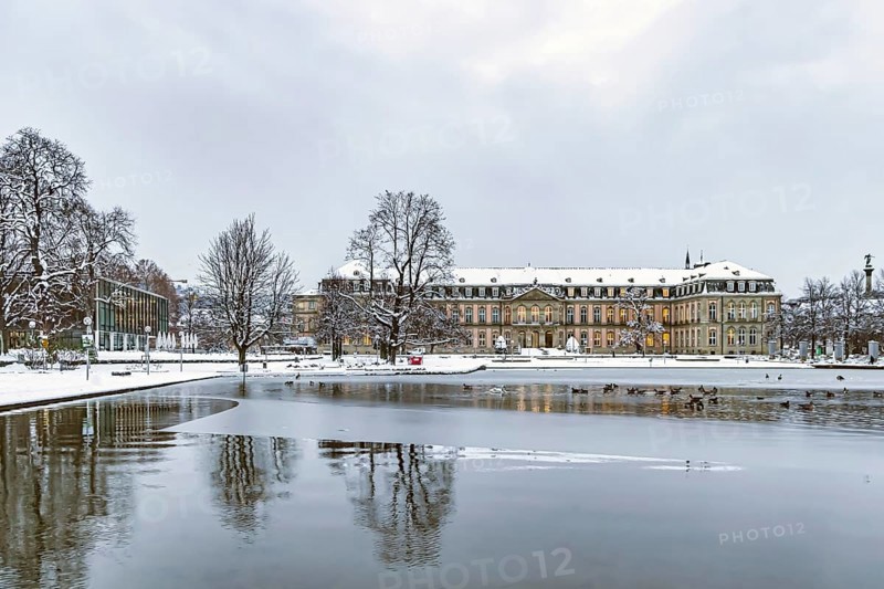 Winter in Stuttgart. It snowed overnight and the city is wintry white early in the morning. New castle with Eckensee. Stuttgart, Baden-Württemberg, Germany