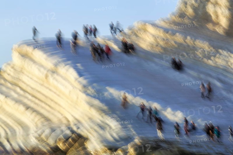 Terraced chalk cliffs Scala dei Turchi, anonymous walkers on Turkish steps, illustration, motion blur, Realmonte, Agrigento, Sicily, south coast, Mediterranean, Italy