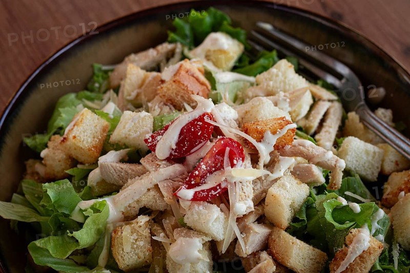 Classic Caesar salad, close-up, natural light, selective focus, horizontal