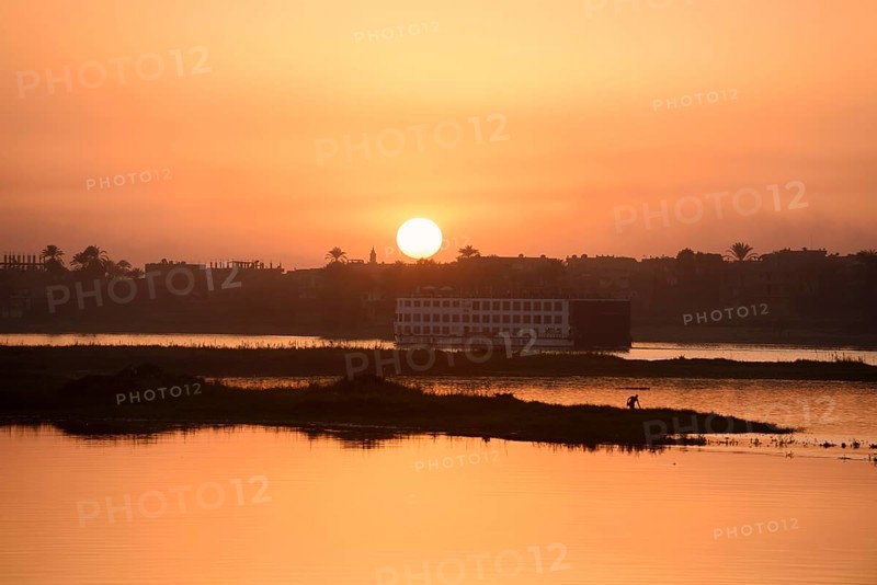 Nile cruise ship at sunset on the Nile, Luxor, Egypt