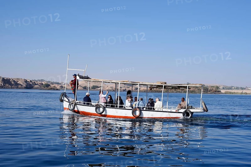 Sightseeing boat with tourists on Lake Nasser, Aswan, Egypt