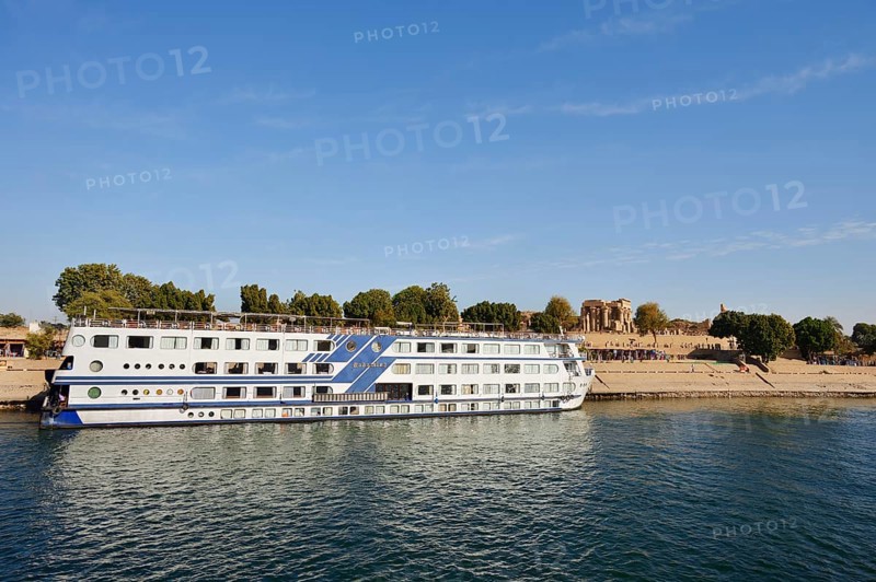 Nile cruise ship Radamis II at pier and double temple of Kom Ombo, Kom Ombo, Egypt