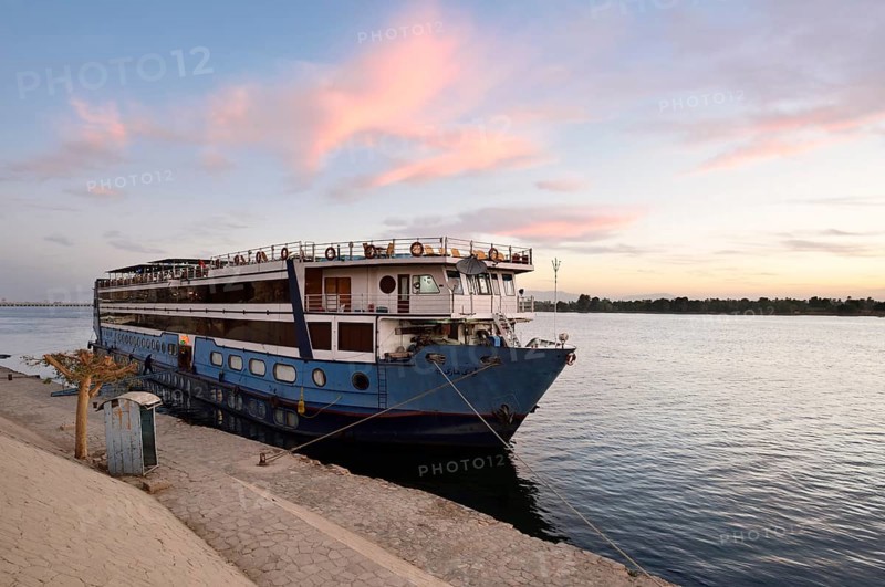 Nile cruise ship at a pier at dawn, Esna, Egypt