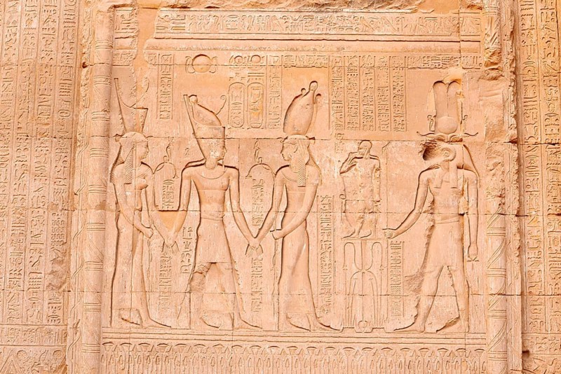 Relief of Emperor Tiberius and the gods, Nechbet, Buto and Khnum and the child god Heka, Chnum temple, Esna, Egypt