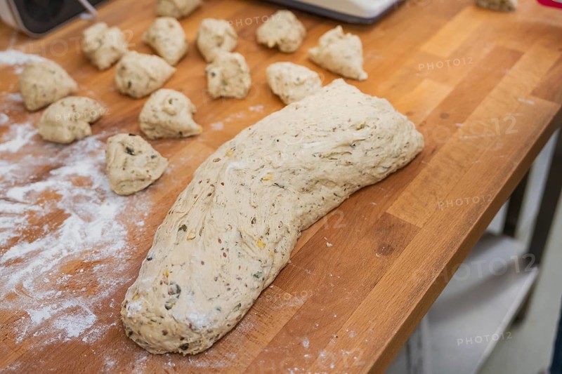 A large lump of dough together with pieces of dough on a wooden table, baking rolls, Haselstaller Hof, Gechingen, Germany