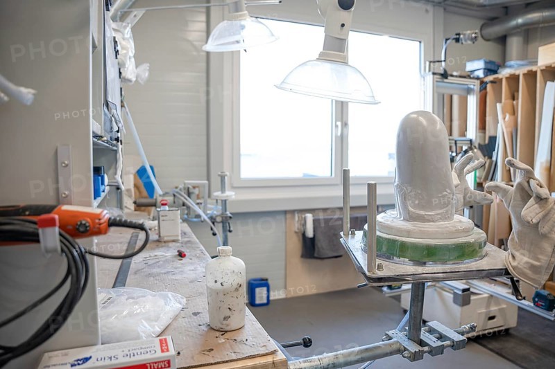 Workshop area with plaster and tools for making prostheses under lamps, medical supply store