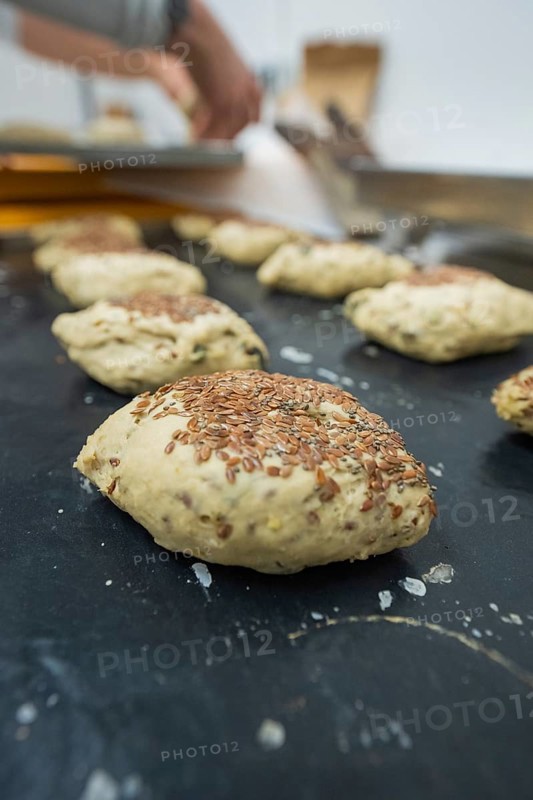 Unbaked dough with linseeds on a baking tray in a kitchen, baking rolls, Haselstaller Hof, Gechingen, Germany