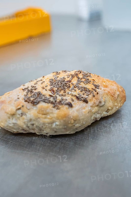 Crispy baked roll with seeds on a metal surface, bake rolls, Haselstaller Hof, Gechingen, Germany