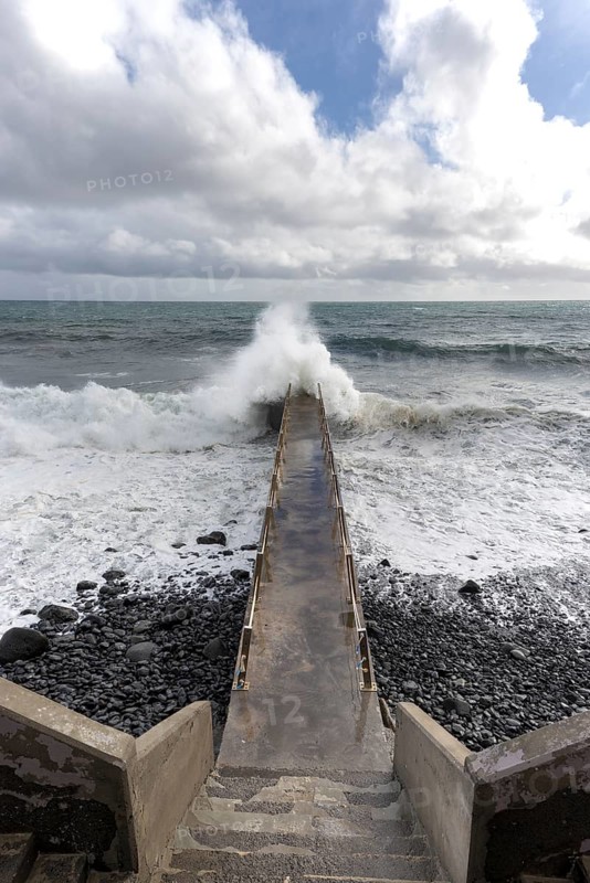 Pier during storm, bridge with waves, Atlantic Ocean, Madeira, Portugal