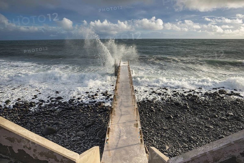 Pier during storm, bridge with waves, Atlantic Ocean, Madeira, Portugal