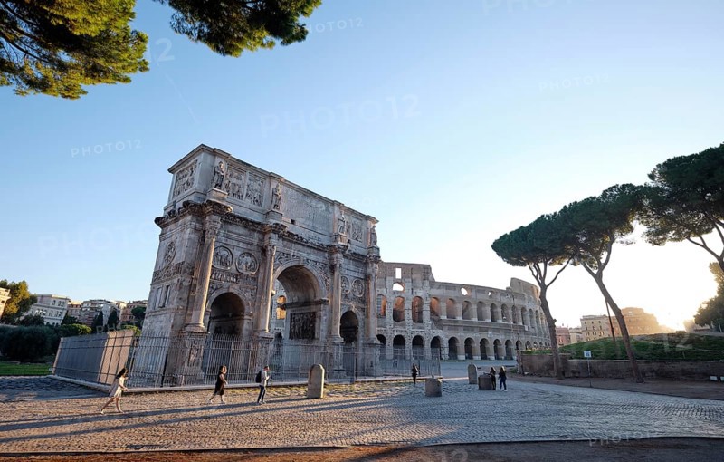 Arch of Constantine and Colosseum at sunrise, Rome, Lazio, Italy