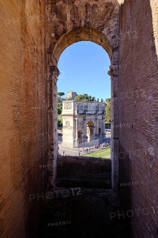 View through round arch of Constantine's Arch from the Colosseum, Rome, Lazio, Italy
