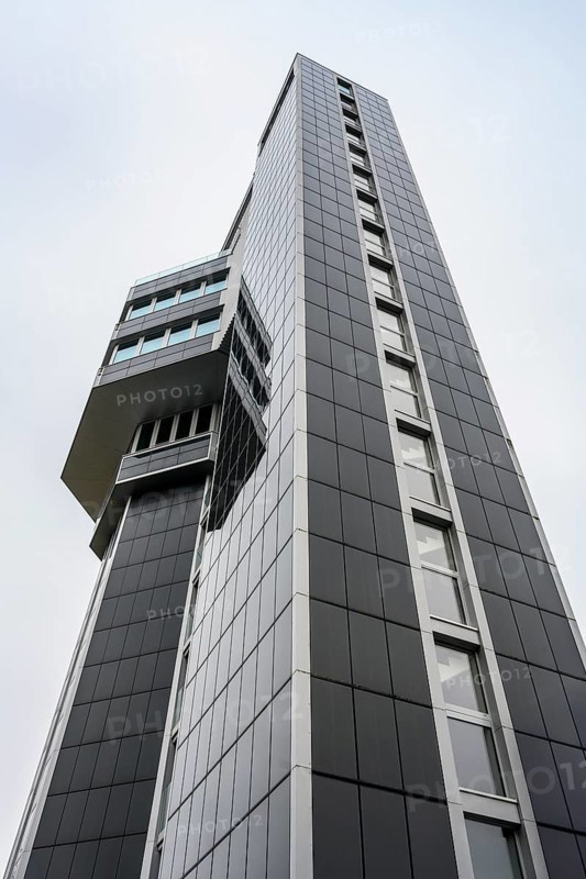 Modern architecture, geometric lines, former water tower of the Radolfzell dairy plant, converted into the Hotel Aqua-Turm since 2017. The world's first zero-energy passive high-rise building, the entire façade consists of around 1000 photovoltaic modules and uses solar thermal energy wind power and hydrothermal energy to produce more energy than it consumes, Konstanz district, Baden-Württemberg, Germany
