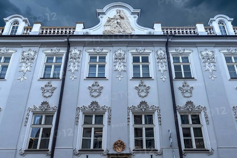 Historic house façade, a relief of Saint Florian on the gable, Krakow, Poland