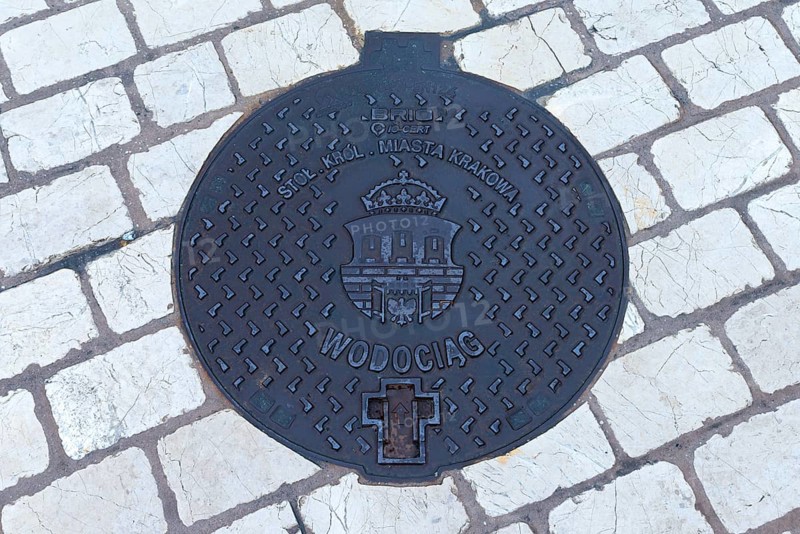 Manhole cover with the coat of arms of Krakow, Krakow, Poland