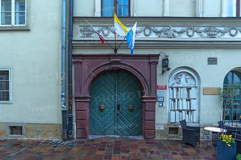 Historic entrance portal with a relief of a bookshelf, Krakow, Poland