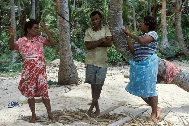 Local 2 woman and a man standing on the beach, Tavewa island, Yasawa archipelago, Fiji