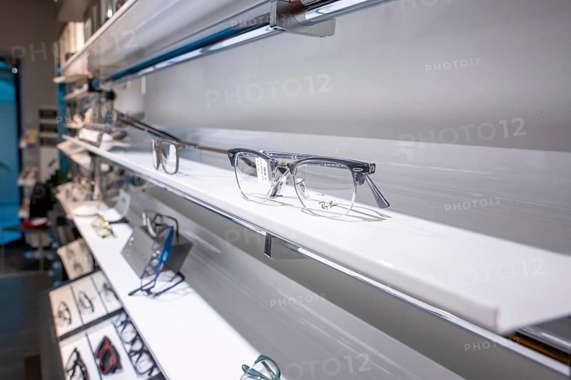 Elegant eyeglass shelf with clear glasses in a modern showroom, optician, Pforzheim