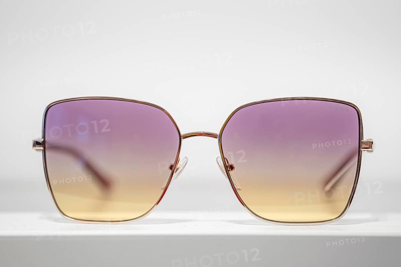 Sunglasses with purple-yellow gradient on white background, optician, Pforzheim