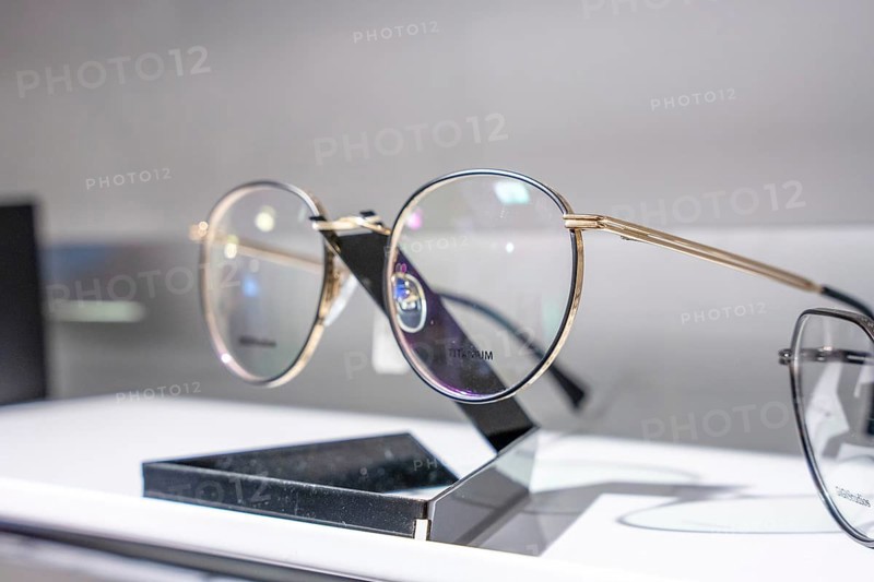 Close-up of modern round glasses on a simple stand, optician, Pforzheim
