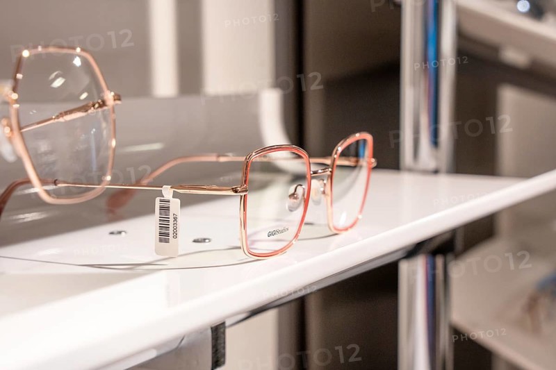 Elegant rose gold glasses presented on a modern shelf, optician, Pforzheim