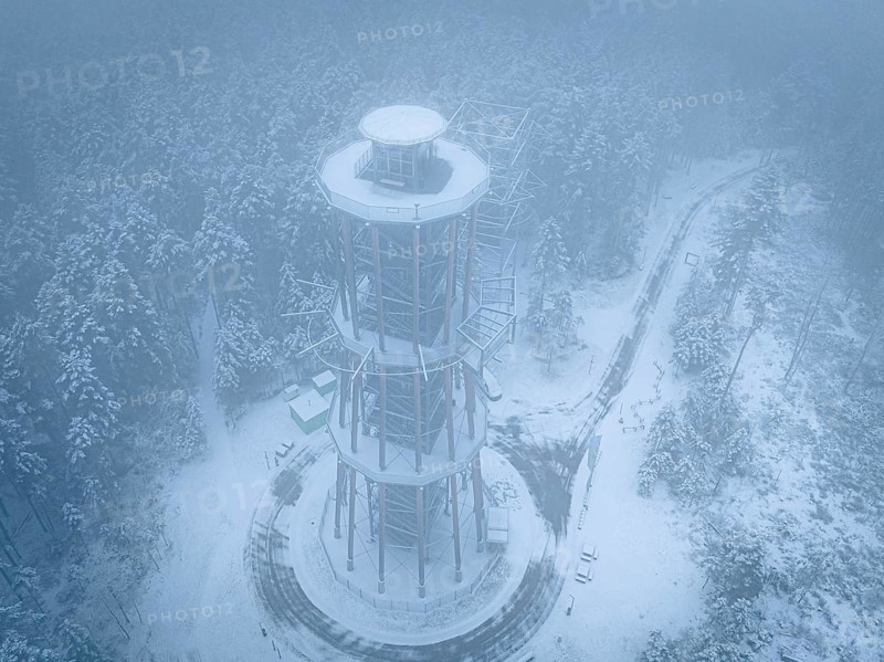 A bird's-eye view of an observation tower stands in a foggy winter landscape, Himmelsglück observation tower with flying fox, Schömberg, Black Forest, Germany