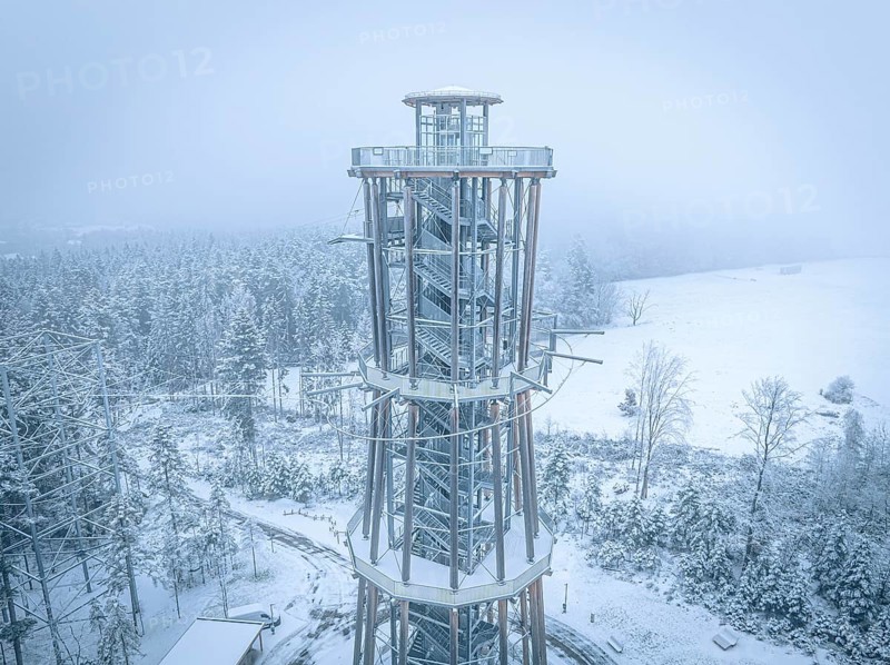 An observation tower in winter fog over a snowy environment, Himmelsglück observation tower with Flying Fox, Schömberg, Black Forest, Germany