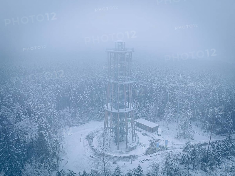 A treetop trail in a foggy, snowy winter landscape from above, Himmelsglück observation tower with Flying Fox, Schömberg, Black Forest, Germany