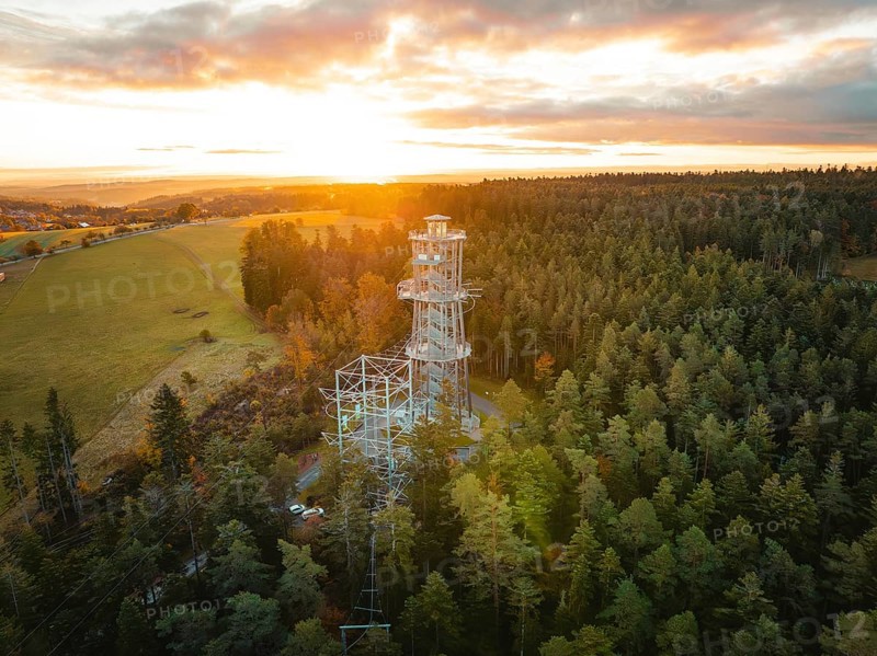 Tower immersed in the warm light of the dawning day, Himmelsglück observation tower with Flying Fox, Schömberg, Black Forest, Germany