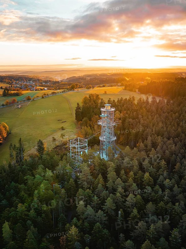 Tower surrounded by forests and meadows at sunset, Himmelsglück observation tower with Flying Fox, Schömberg, Black Forest, Germany