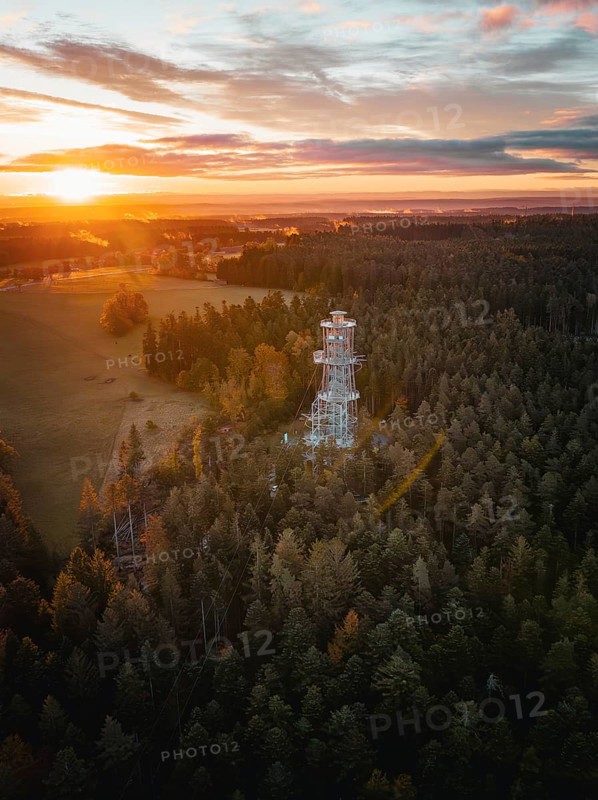 Landscape view with observation tower in foreground and sunset, Himmelsglück observation tower with Flying Fox, Schömberg, Black Forest, Germany