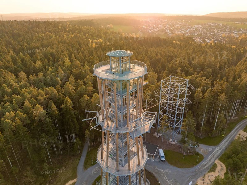 A high observation tower in the forest, surrounded by trails and illuminated by evening light, Himmelsglück observation tower with Flying Fox, Schömberg, Black Forest, Germany
