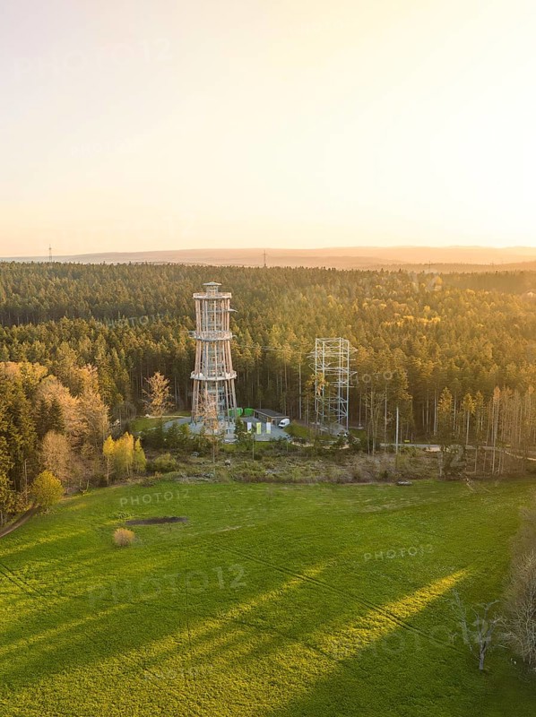 Tower in open area with forests at sunset, sky in evening light, observation tower Himmelsglück with Flying Fox, Schömberg, Black Forest, Germany