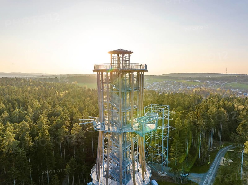 High observation tower in a wooded area at sunset with a view over the valley, Himmelsglück observation tower with flying fox, Schömberg, Black Forest, Germany