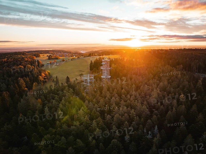 Sunset behind an observation tower in the middle of a vast forest, Himmelsglück observation tower with Flying Fox, Schömberg, Black Forest, Germany
