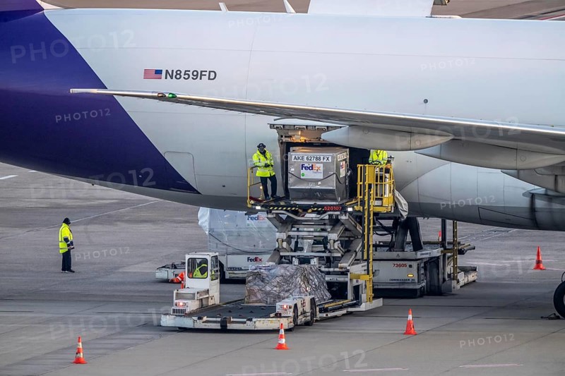 FedEx Boeing 777-FS2 cargo plane is unloaded, air freight container, air freight center at Cologne/Bonn airport, North Rhine-Westphalia, Germany