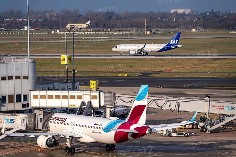 Düsseldorf Airport, DUS, Terminal A Eurowings plane at the gate, SAS plane after landing