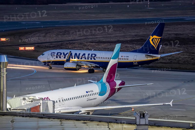 Ryanair Boeing 737-800 after landing at Cologne/Bonn airport, on the taxiway to the terminal, Eurowings plane at the gate, North Rhine-Westphalia, Germany