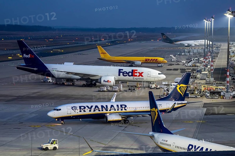 Air freight center, FedEx Boeing 777-FS2, DHL aircraft, UPS Boeing 747, jumbo jet, cargo aircraft, Ryanair Boeing 737 on the way to takeoff, at Cologne/Bonn airport, aircraft at the terminal, North Rhine-Westphalia, Germany