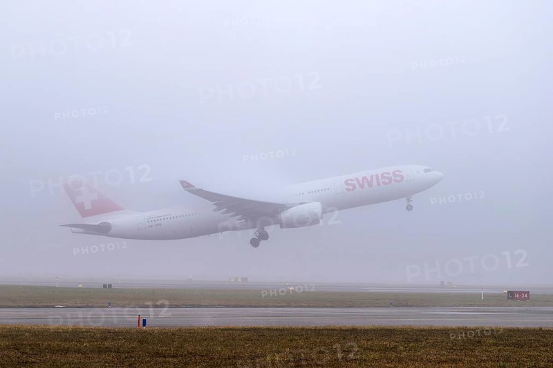 Swiss aircraft, HB-JHG, Airbus A330-300, departure in fog, Zürich Kloten, Switzerland